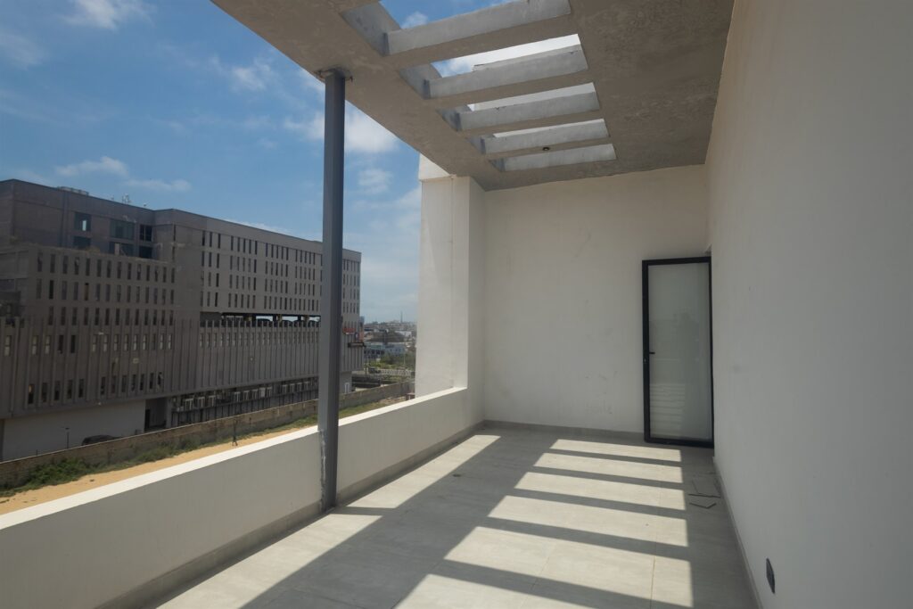 Brum Height 4: Sunlit balcony beneath a pergola roof